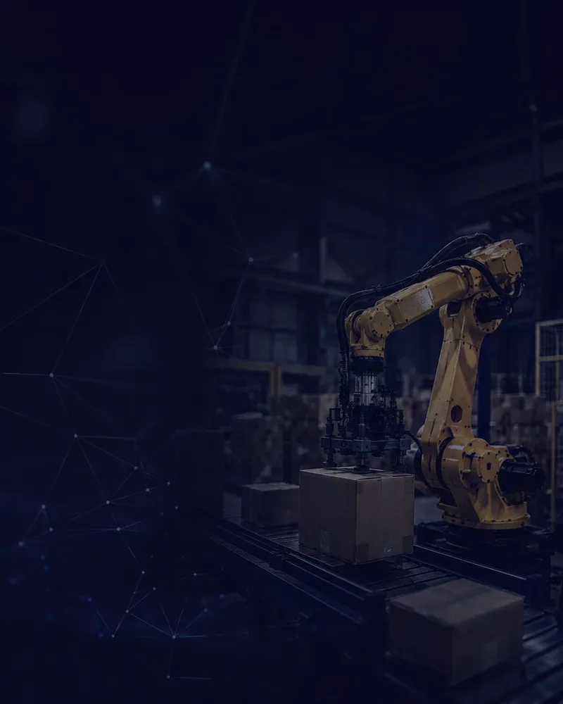 Técnicos operando un robot FANUC en una celda automatizada