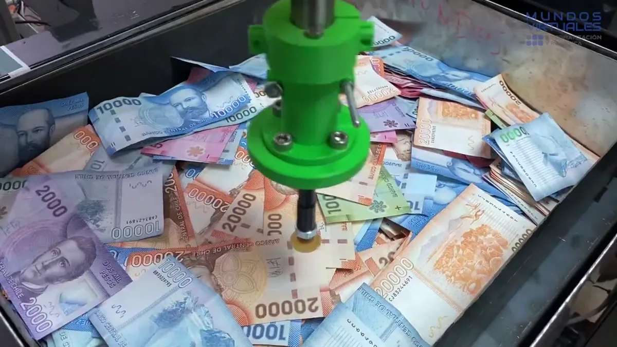 Gripper a medida impreso en 3D tomando un billete
